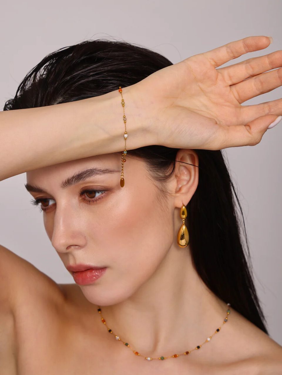 Nature Palette Bracelet on model highlighting natural gemstone charm and gold chain detail