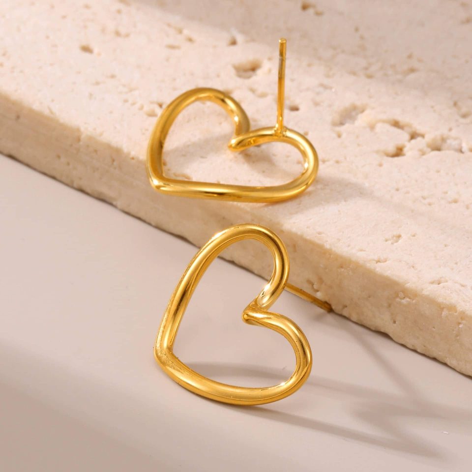 Gold Hollow Heart Drop Earrings with 18K Gold-Plated Finish on Fabric