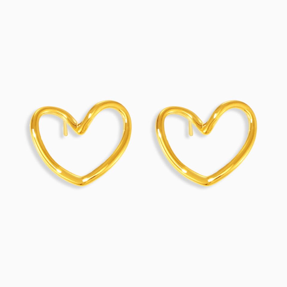 Hollow heart-shaped gold drop earrings in 18K gold-plated stainless steel on white background