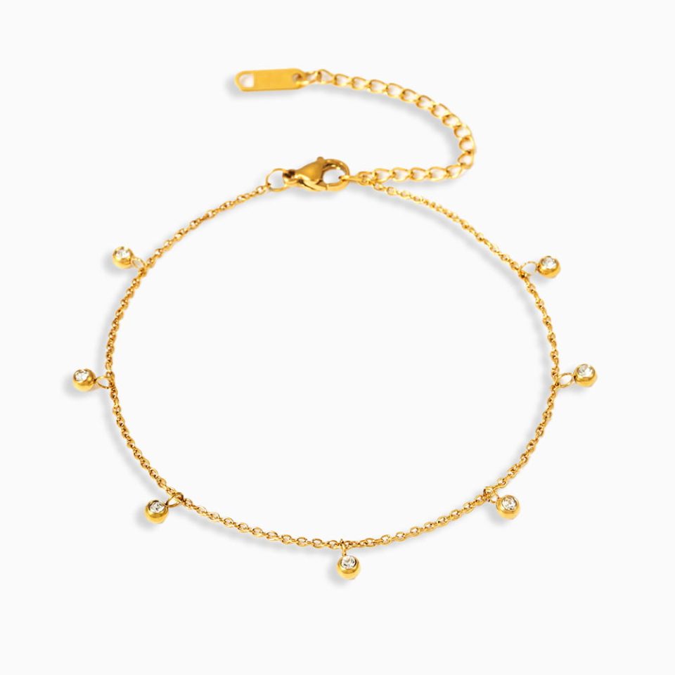 Close-up of gold beaded zircon permanent anklet made of waterproof stainless steel, minimal and dainty design