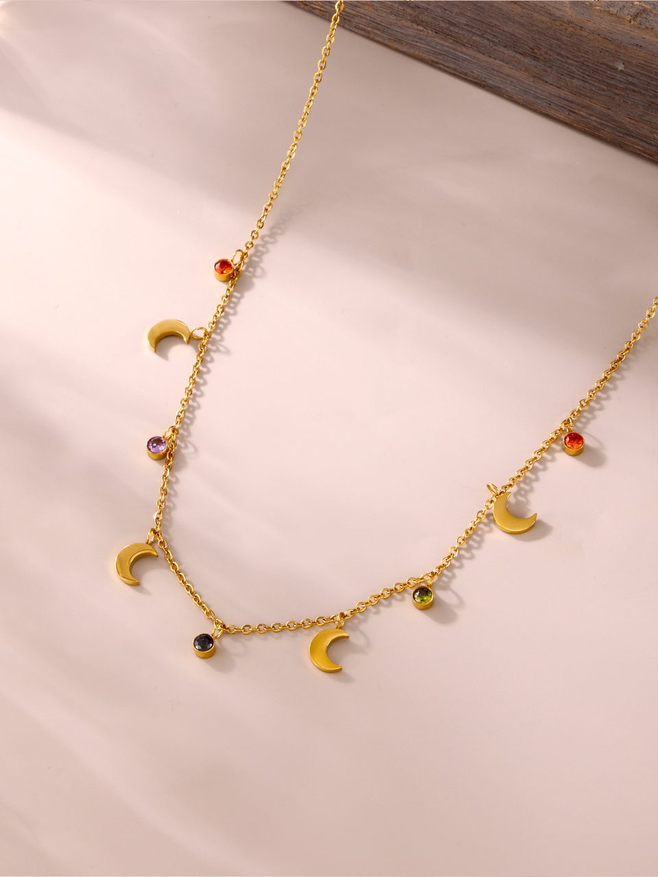 Detail of multicolor crystals on Oudada Moon Tassel Necklace