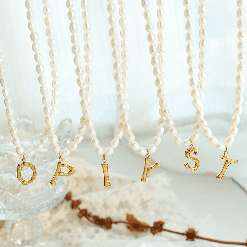 Gold-plated titanium steel pearl necklace flat lay
