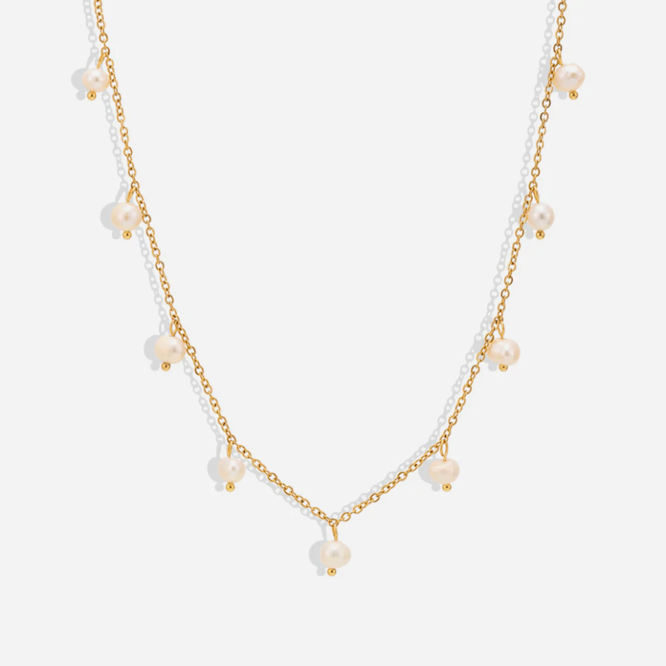 Maggie Multi-Layered Pearl Station Choker Necklace display, multi-layered pearl station choker, elegant and fashionable