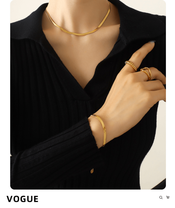 Model wearing titanium steel necklace and bracelet set with black outfit