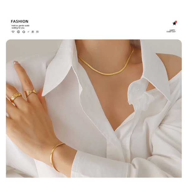 Model wearing titanium steel necklace and bracelet set with white outfit