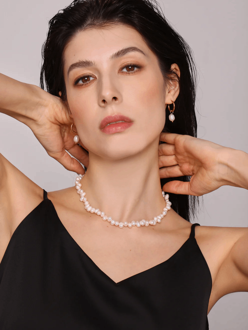 Model wearing Rita Pearl Choker, front view, natural freshwater pearls