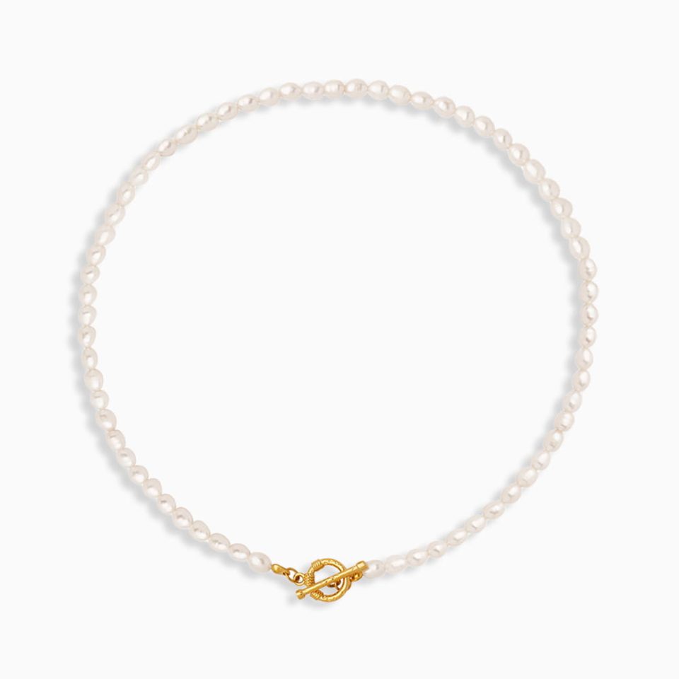 Dainty freshwater pearl necklace with 18K gold chain on white background