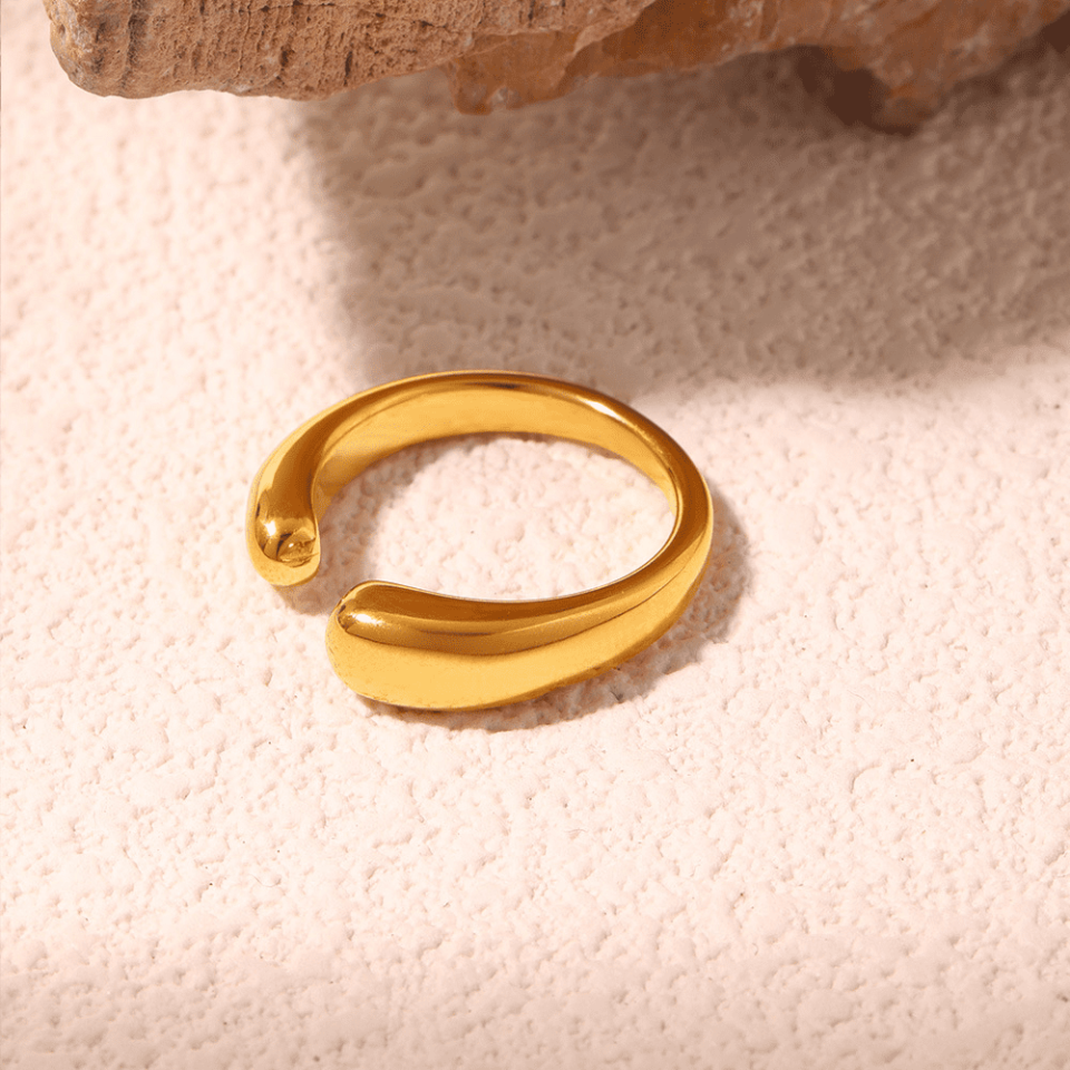 Stacked gold and steel open arc rings on fingers - Oudada minimalist adjustable jewelry for layered looks