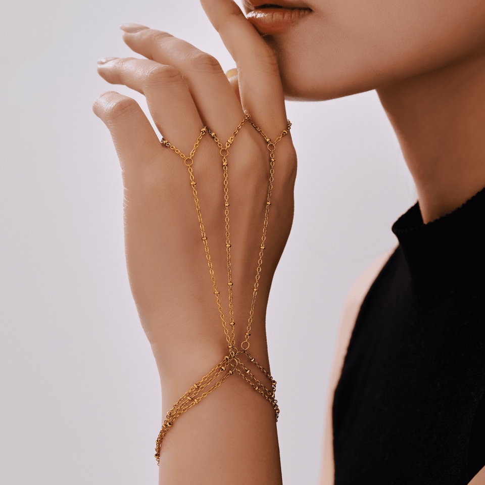 E597 gold finger chain bracelet with instagrammable jewelry flat lay