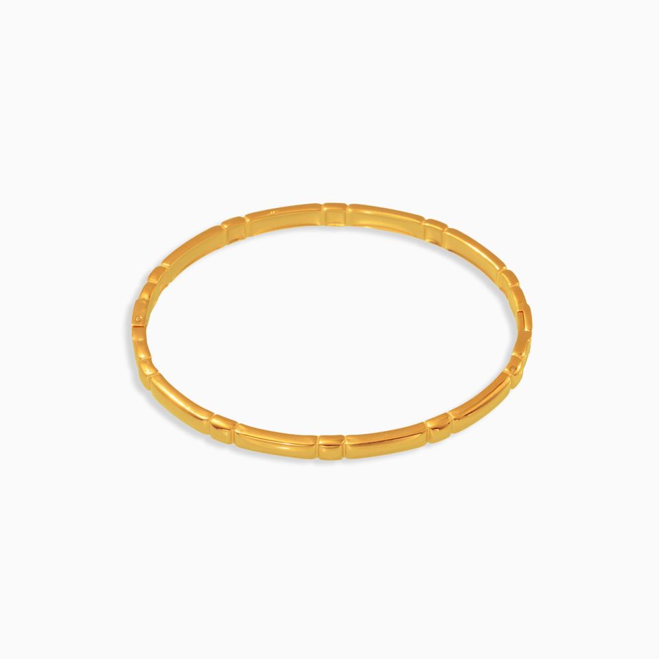Elegant thin circle gold cuff bangle made of 18K gold-plated stainless steel on white background