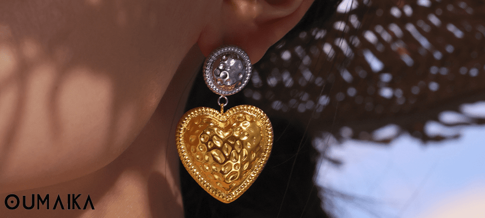Elegant dangler earrings displayed on a jewelry stand