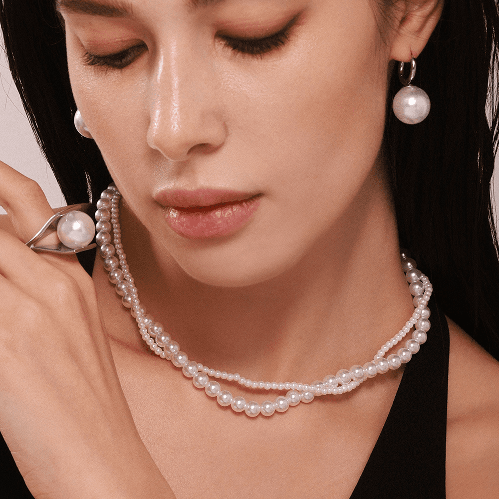 Timeless Pearl Choker for Classic Feminine Charm Elegant pearl choker necklace on model’s neck close-up