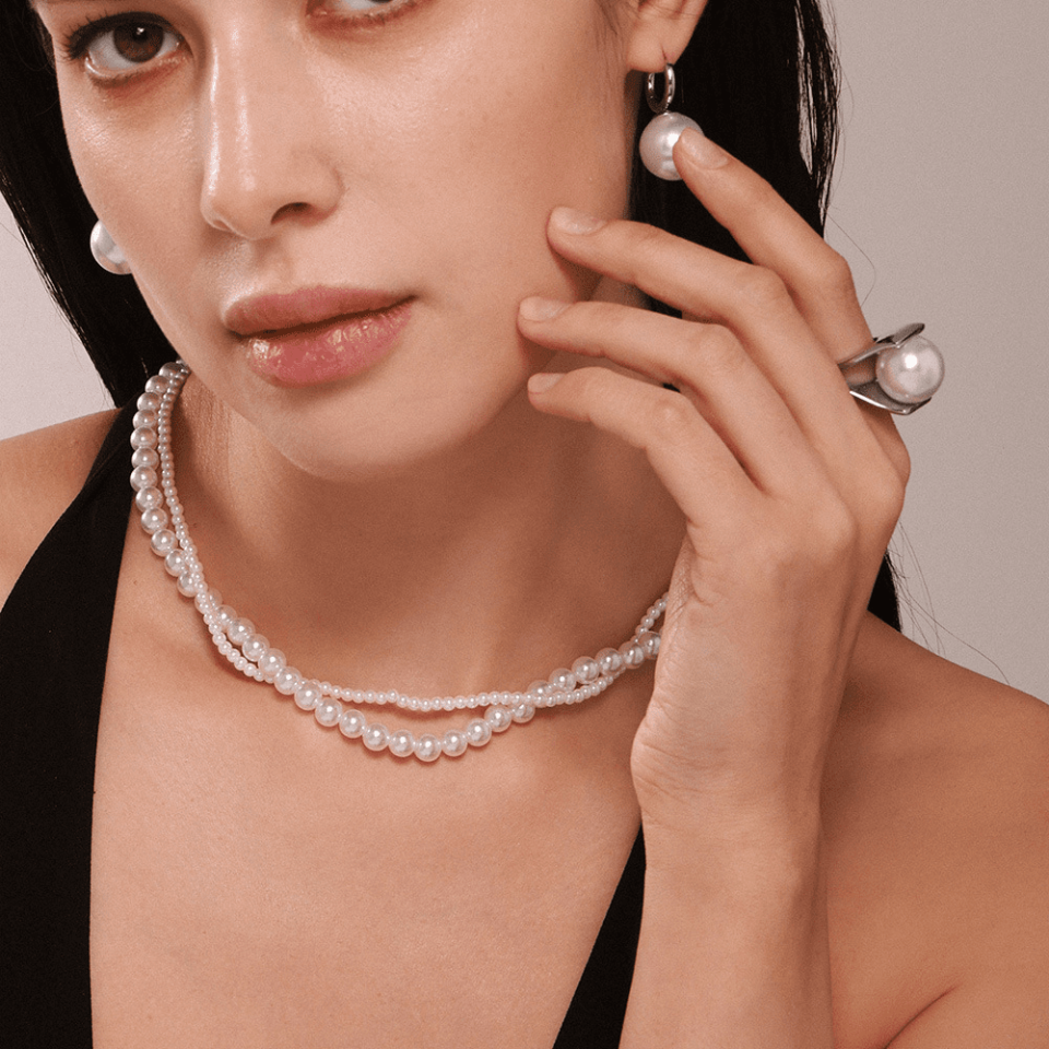 Model wearing Double Layer Pearl Necklace Set, showcasing elegant style