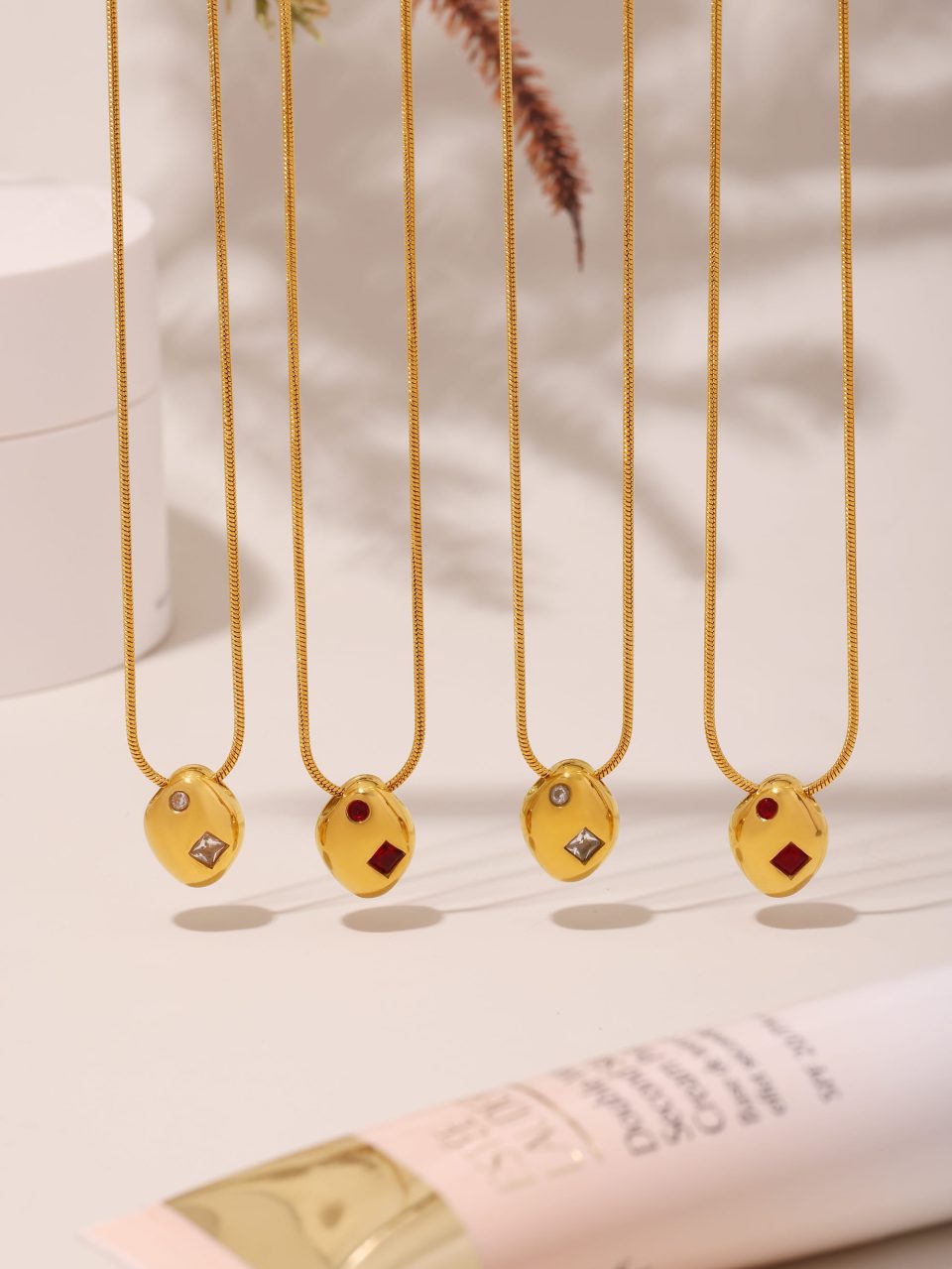A geometric prism freeform necklace displayed in a stylish setting, featuring intricate facets that catch the light, perfect for fashion-forward individuals seeking unique jewelry.