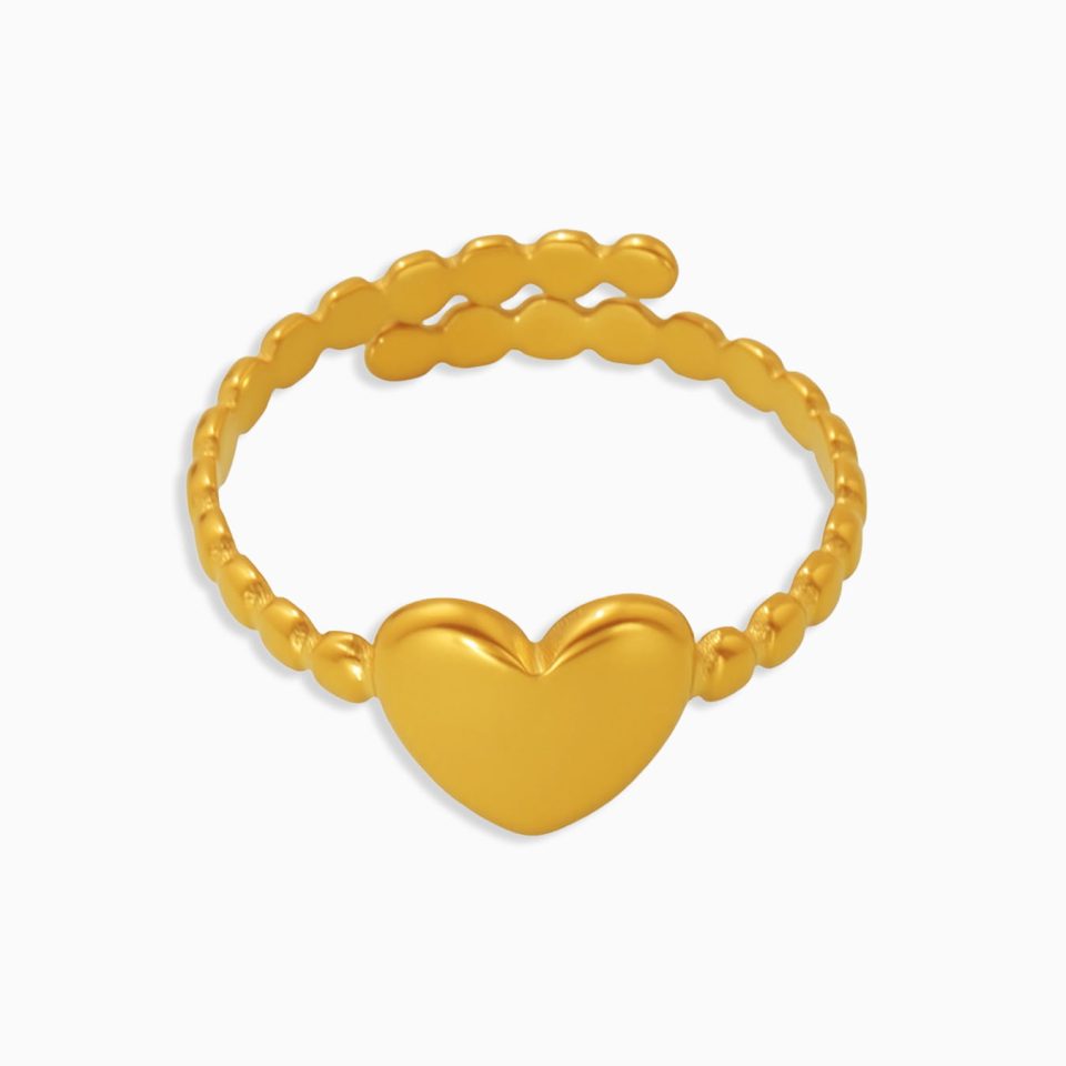 Gold open heart ring with coral enamel finish on white background