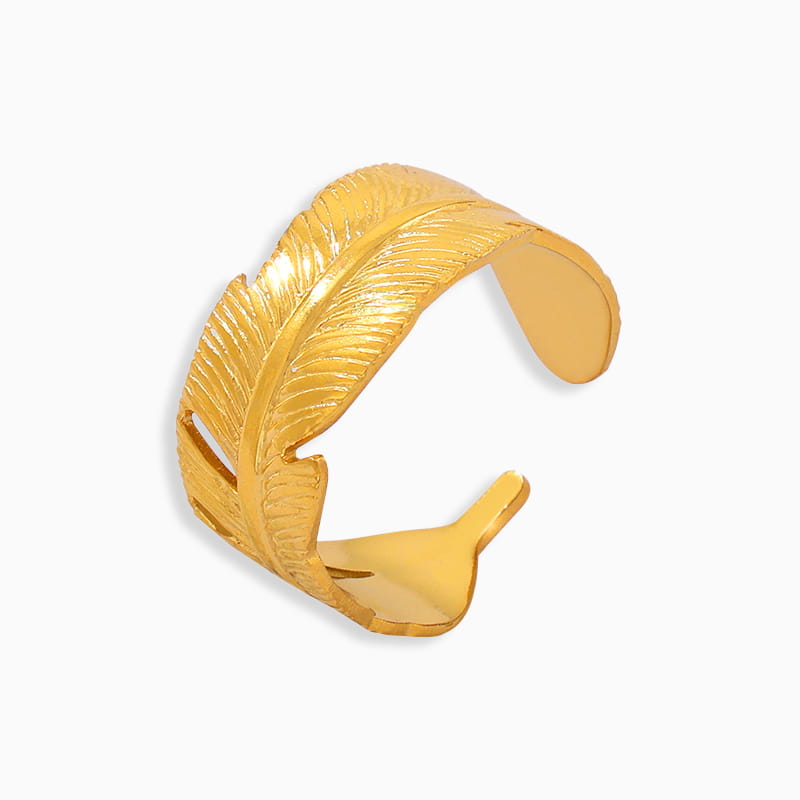 Minimalist gold open ring with split top design on white background.