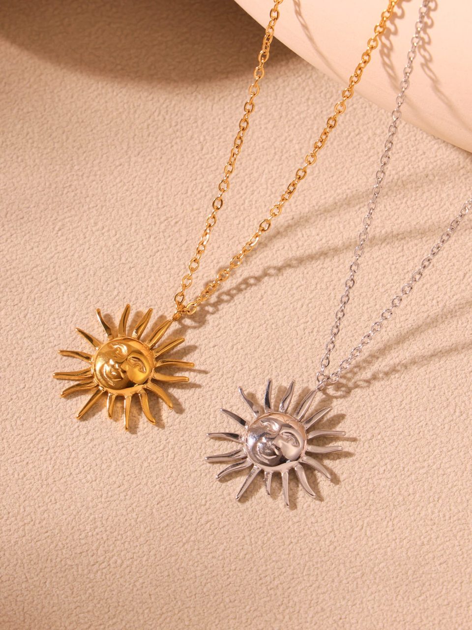 Gold and silver sun goddess necklaces styled with boho summer outfits