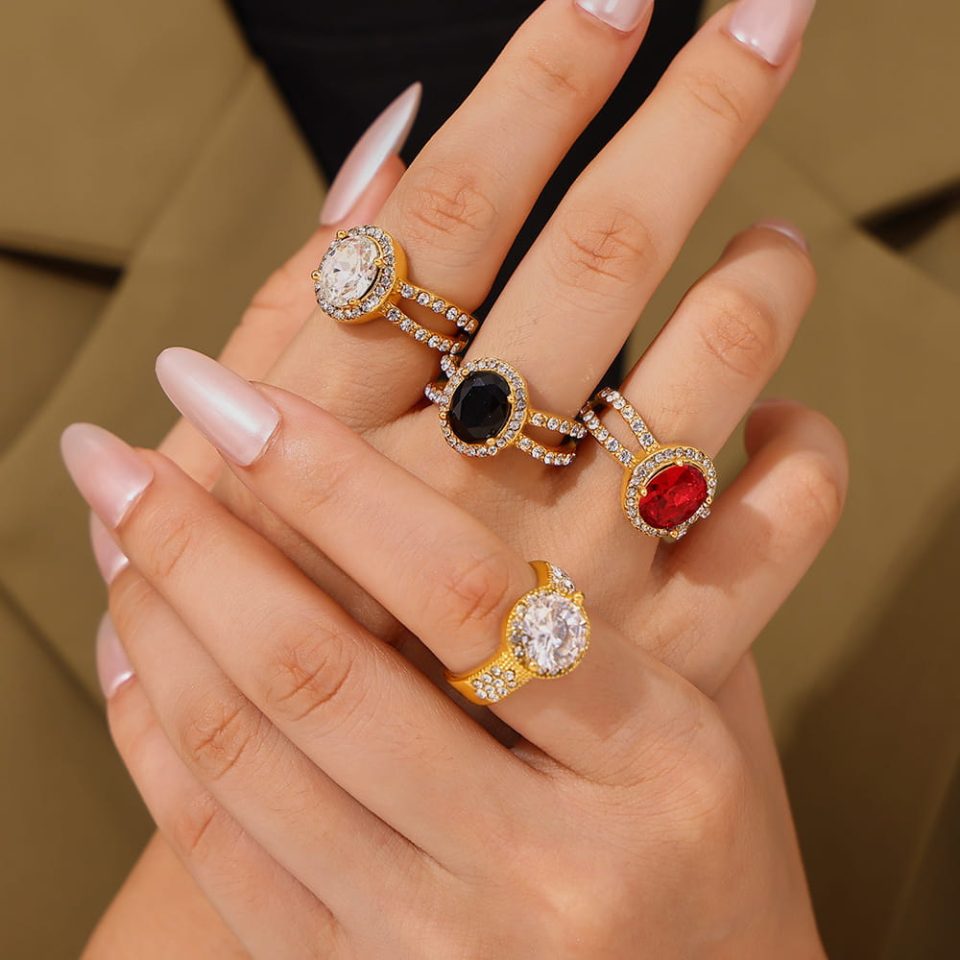 Modern woman wearing oval cubic zirconia vintage ring with stainless steel band on slender finger