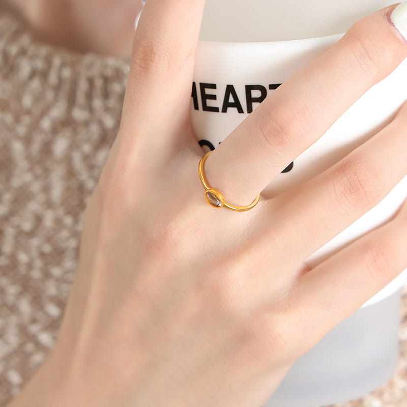 Red oval cubic zirconia statement ring on feminine hand | Affordable luxury jewelry