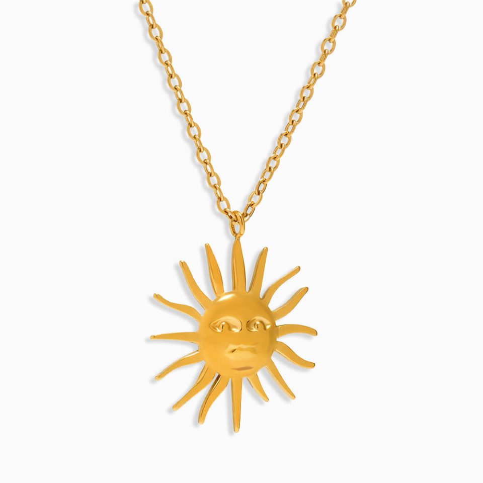 Gold sun and moon pendant necklace made of hypoallergenic stainless steel, shown on a white background