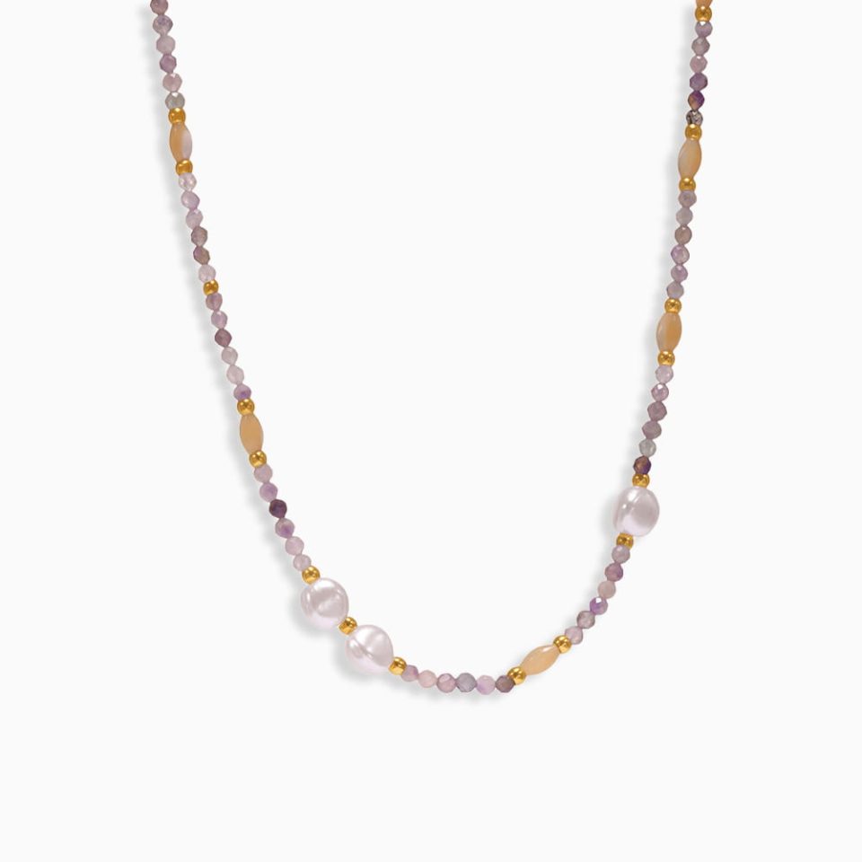 Gold petite heart pendant necklace with natural stone on stainless steel clavicle chain, white background