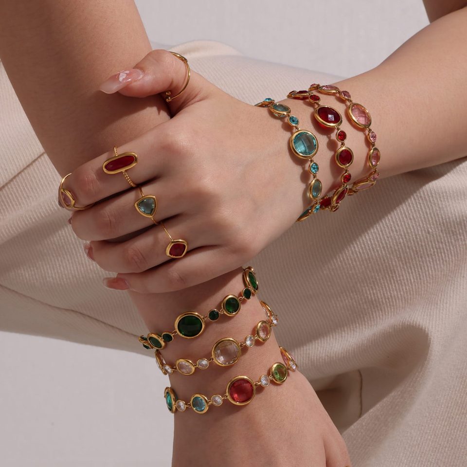 Model wearing gold glass stone bracelet txe275