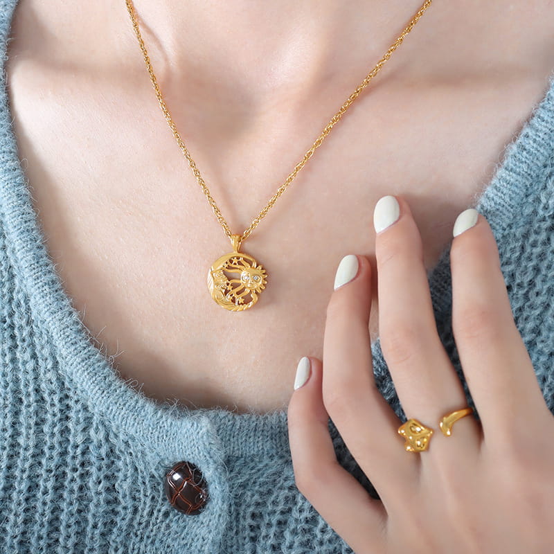 Model wearing gold sun and moon necklace P1473