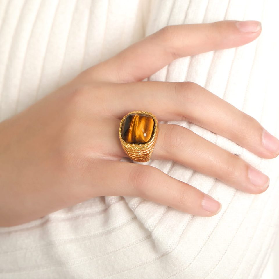 Model wears a gold-colored tiger's eye ring A620-