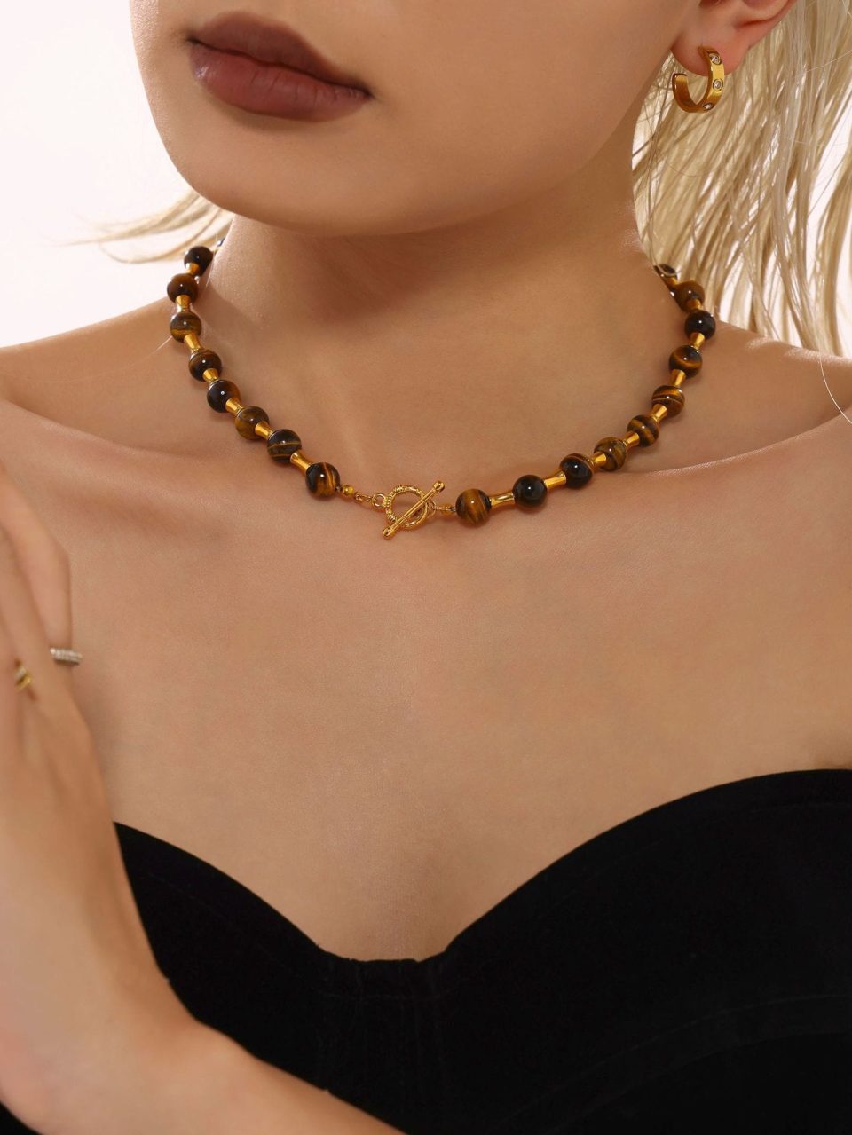 Model wearing Tiger Eye Beaded Choker Necklace with gold bamboo-style chain