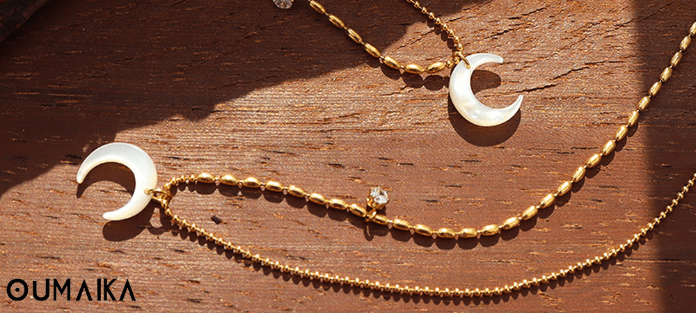 Sun Moon Necklace Symbolism Oumaika Jewelry Symbolic sun and moon pendant necklace in warm light