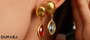 Red and Green sea glass drop earrings with stainless steel hooks and seashell background