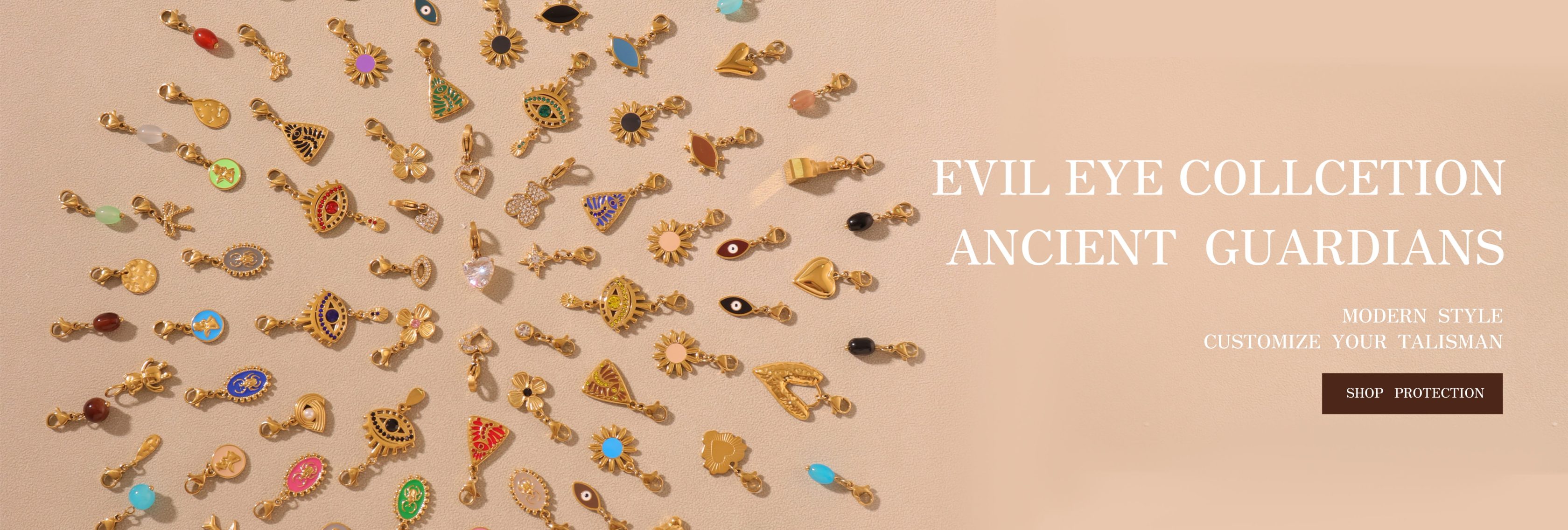 Colorful gold-plated evil eye and talisman charms arranged on a beige background