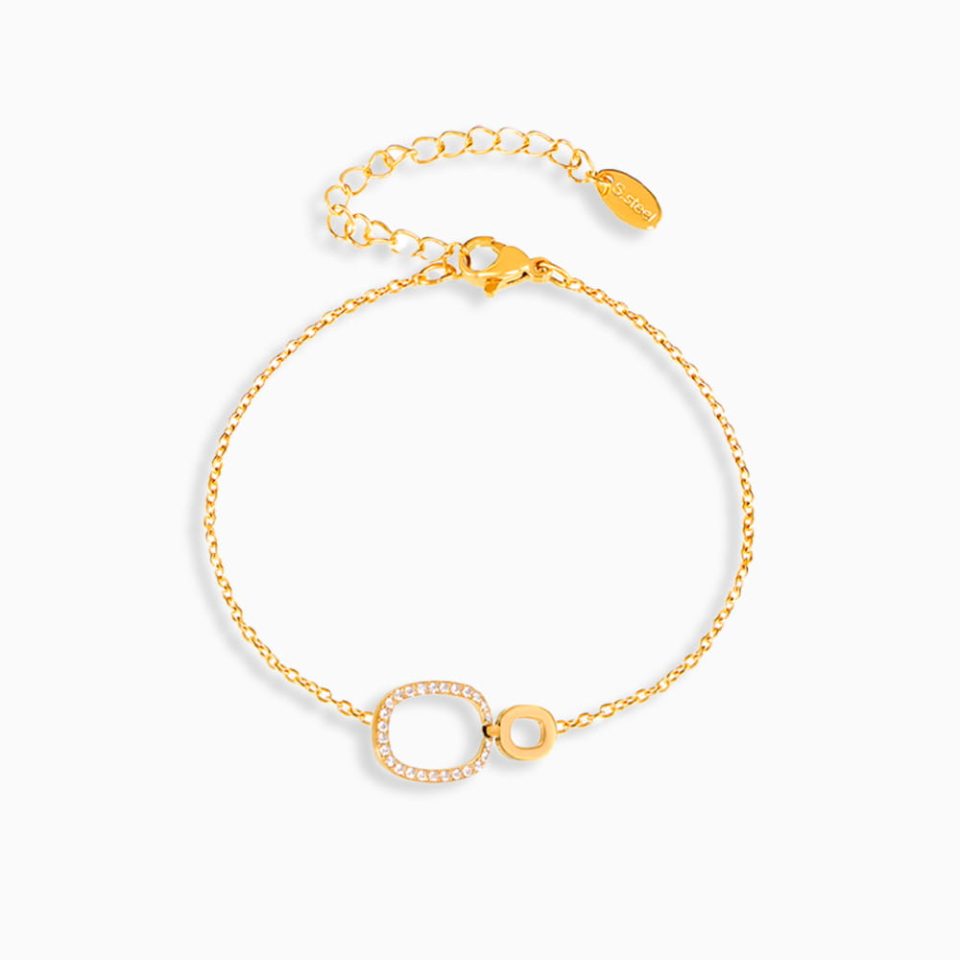 Gold duo circle stainless steel bracelet with cubic zirconia on white background.