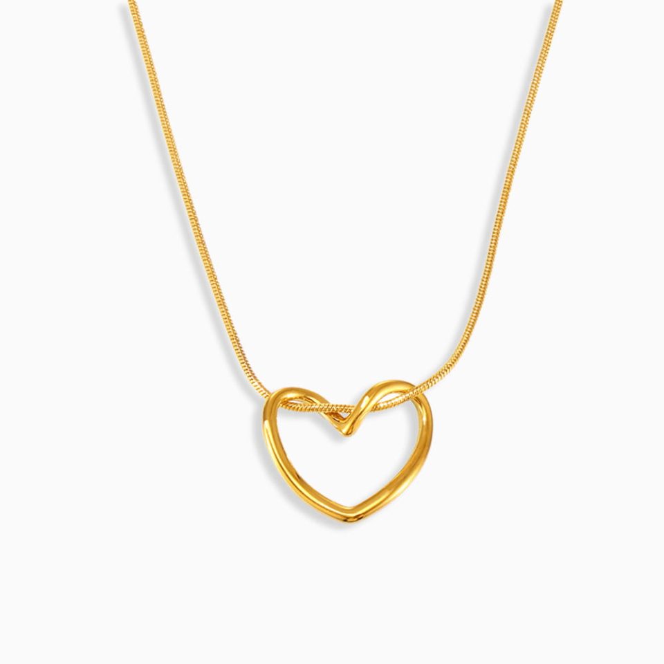 Gold Petite Heart Charm Necklace on white background – stainless steel, minimalist design