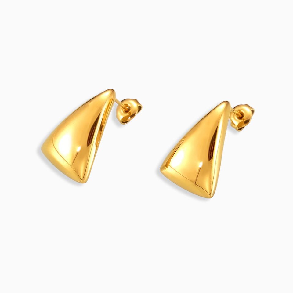Pair of gold triangle stud earrings on white background