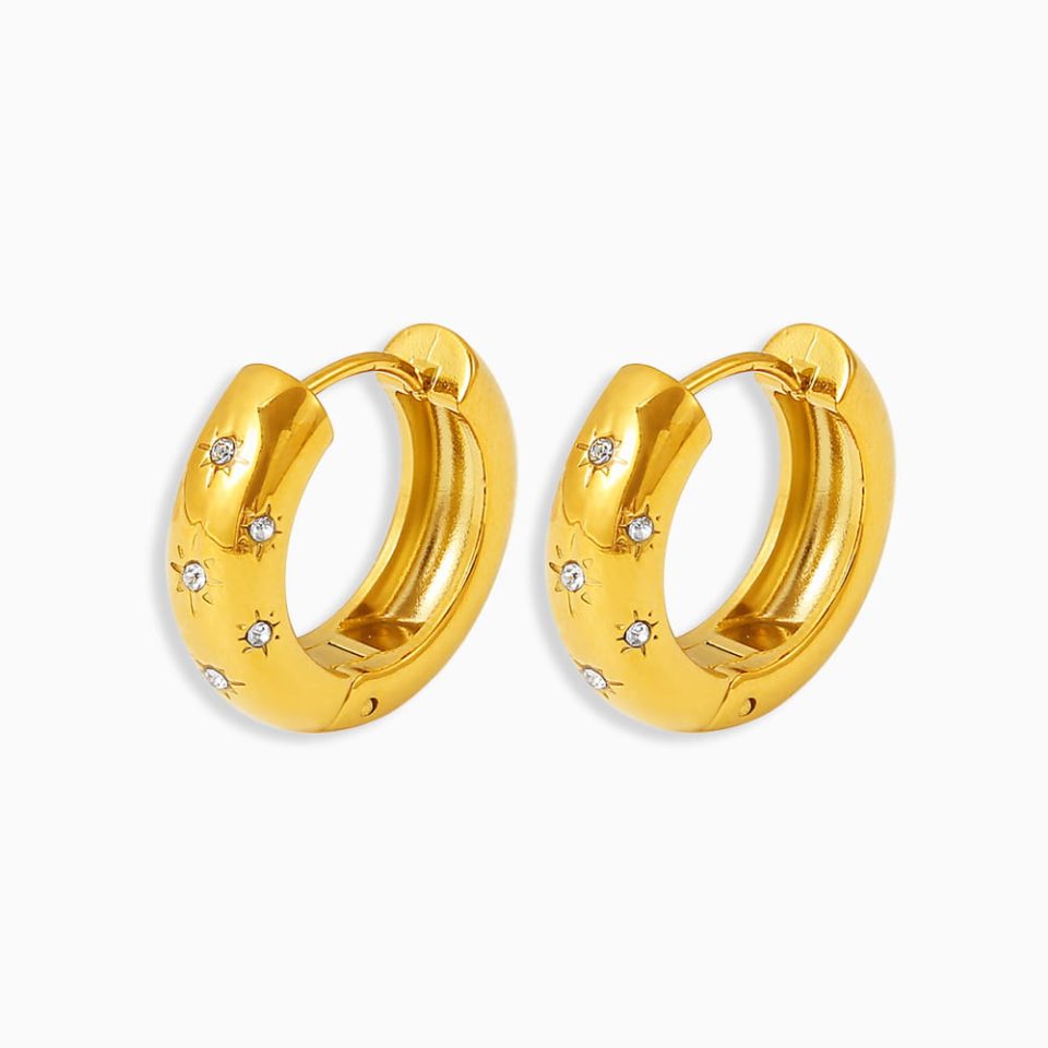 Gold stainless steel mini hoop earrings with celestial charm, white background
