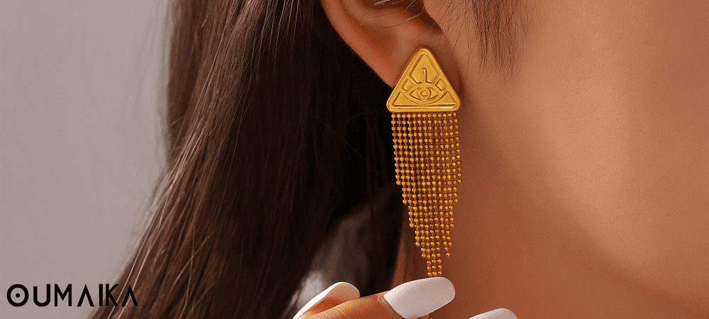 2025 Trendy Tassel Earrings for Women – Oumaika Elegant woman wearing tassel earrings under natural sunlight, showcasing modern fashion style.