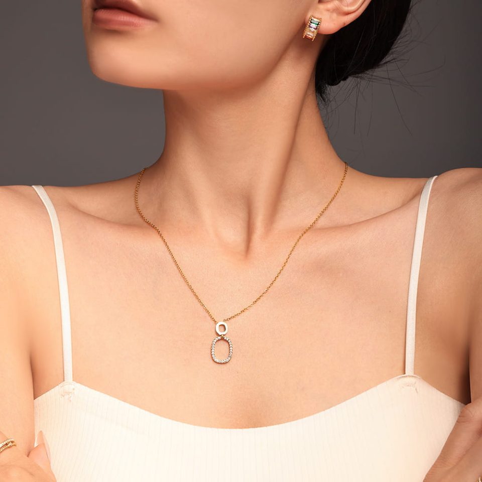 Model wearing gold Luxe Circles CZ Tennis Necklace – layered jewelry styling