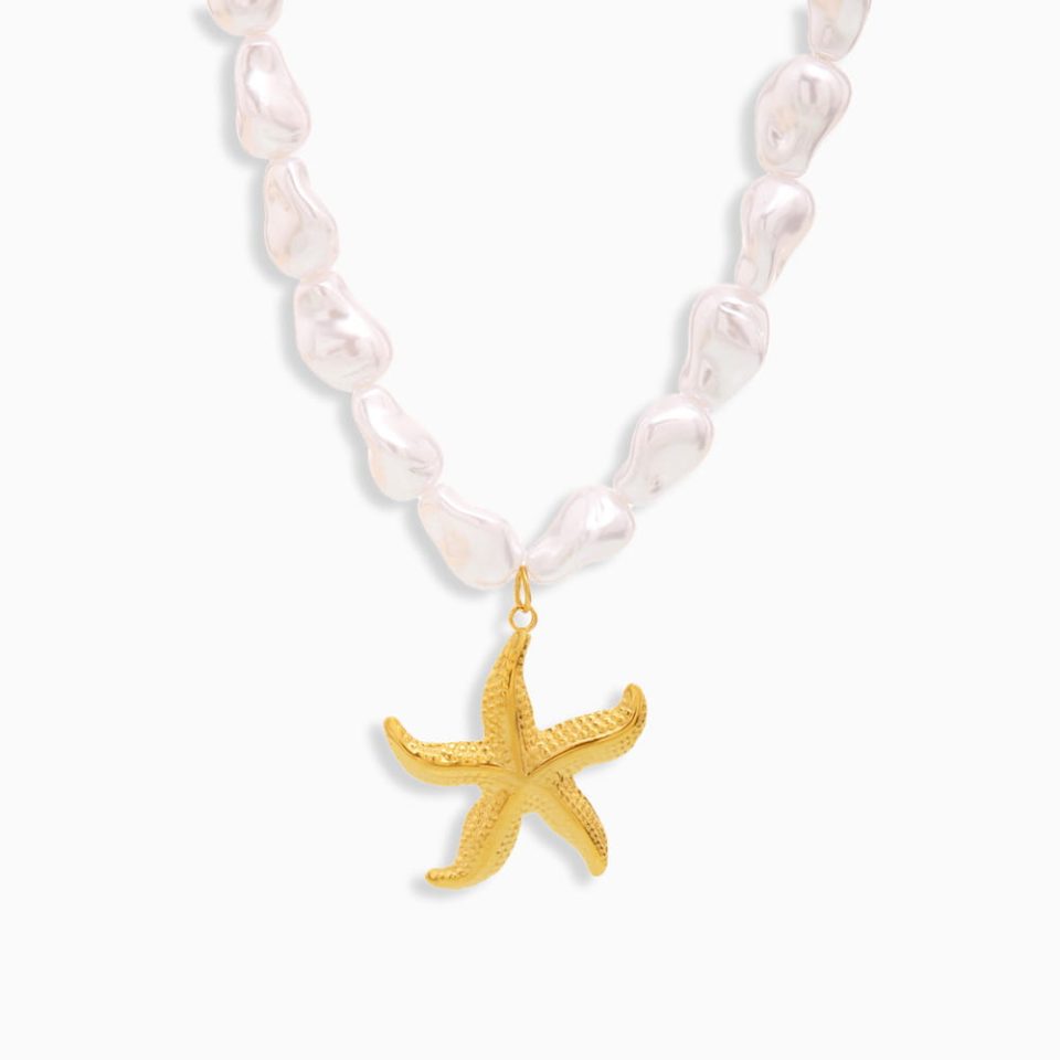 Mother of Pearl necklace with star pendant and stainless steel beads on white background