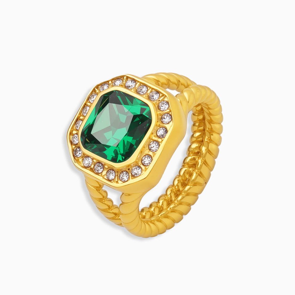 Turquoise geometric statement ring with gold stainless steel setting on white background