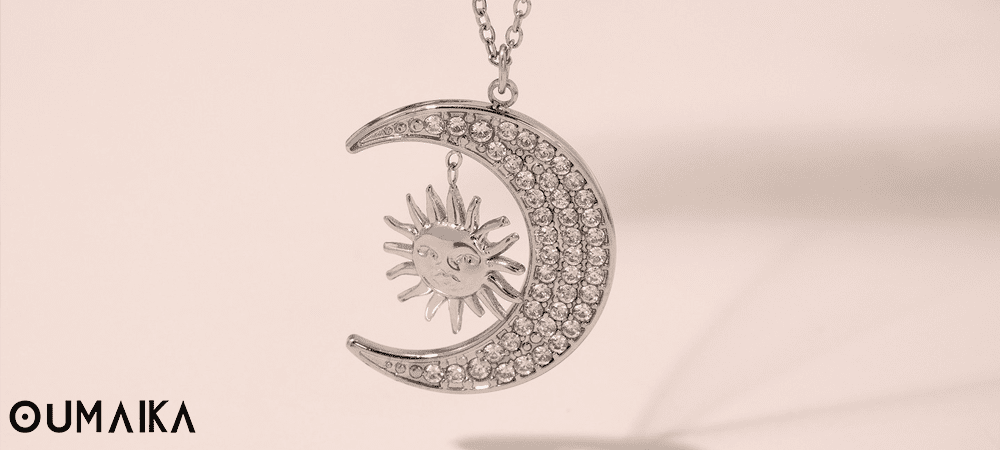 Sun and Moon Stainless Steel Necklace Detail Oumaika Minimalist sun and moon necklace in stainless steel with engraved celestial detail