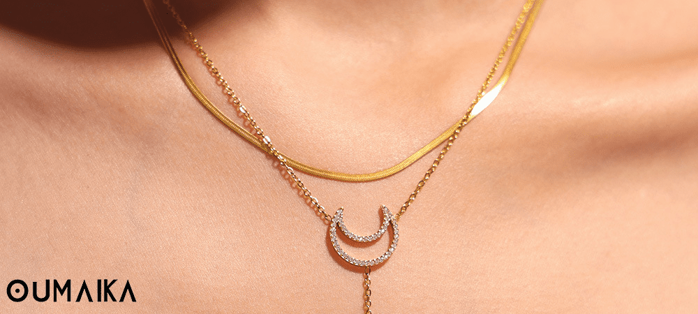 Mixed Metal Sun Moon Necklace Styling Oumaika Layered celestial necklace styling with gold and silver accents
