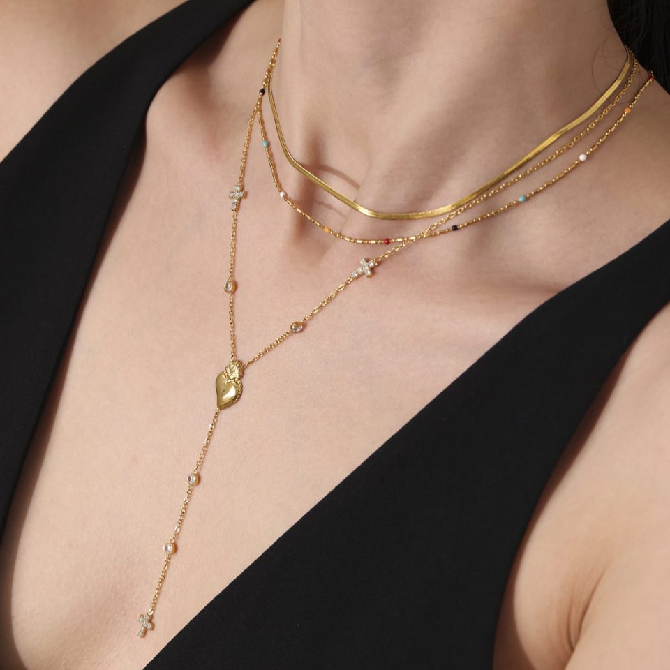 Model wearing 5A zircon cross heart long necklace in 18K gold stainless steel