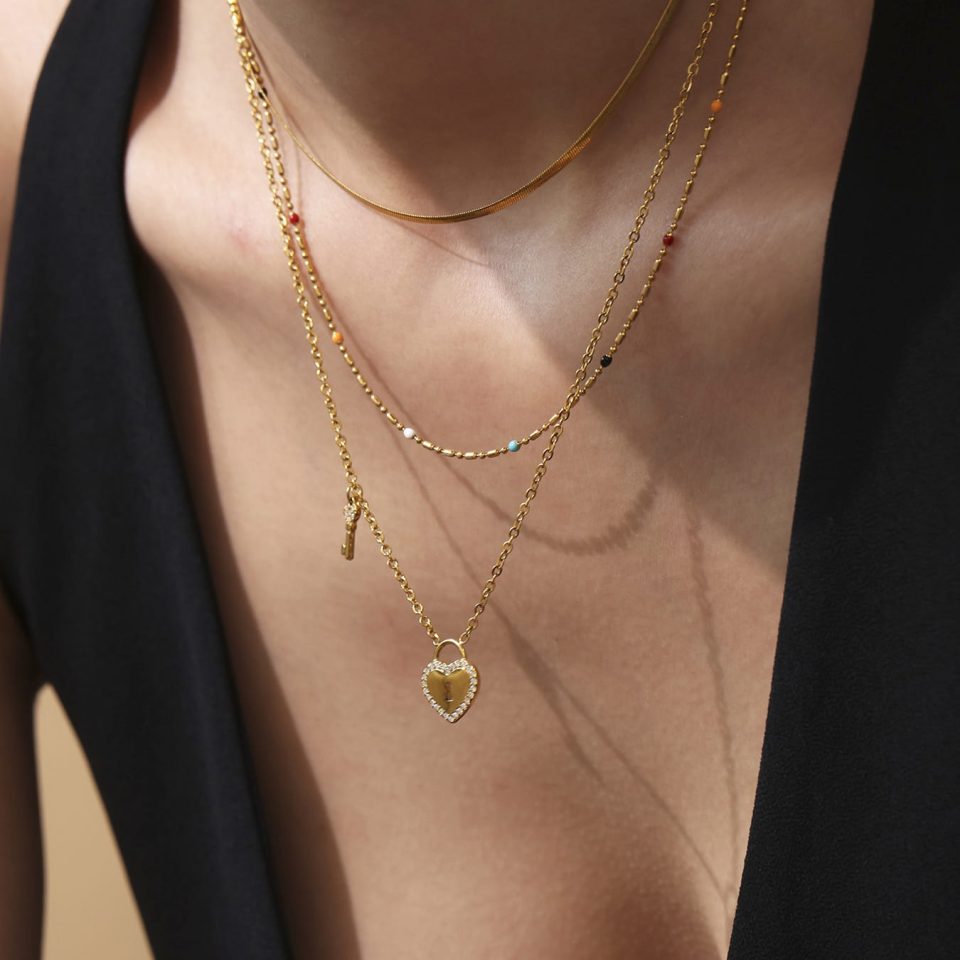 Model Wearing Layered Gold Heart Lock and Key Pendant Necklace with 5A Cubic Zirconia