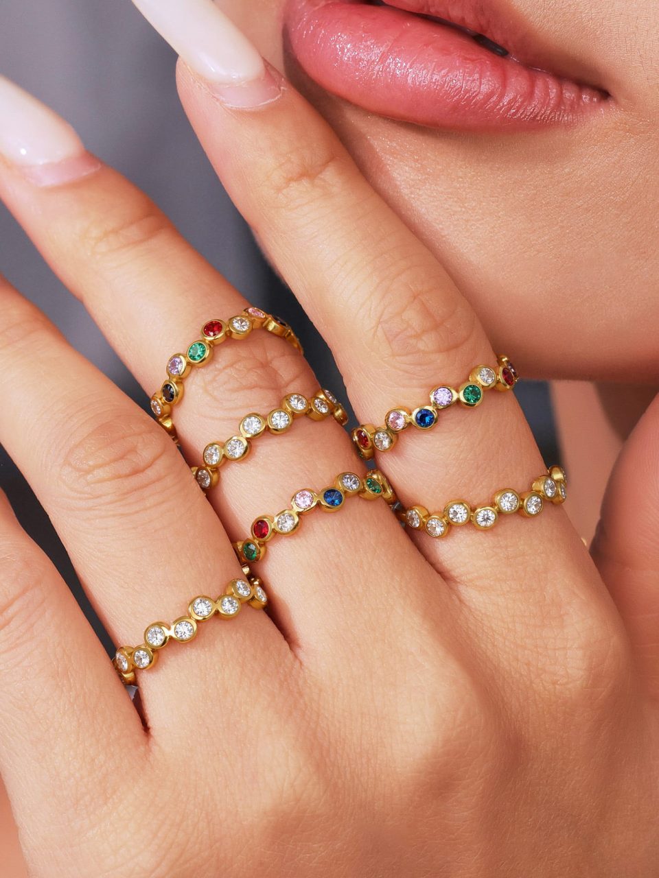Model wearing a colored zircon ring A450