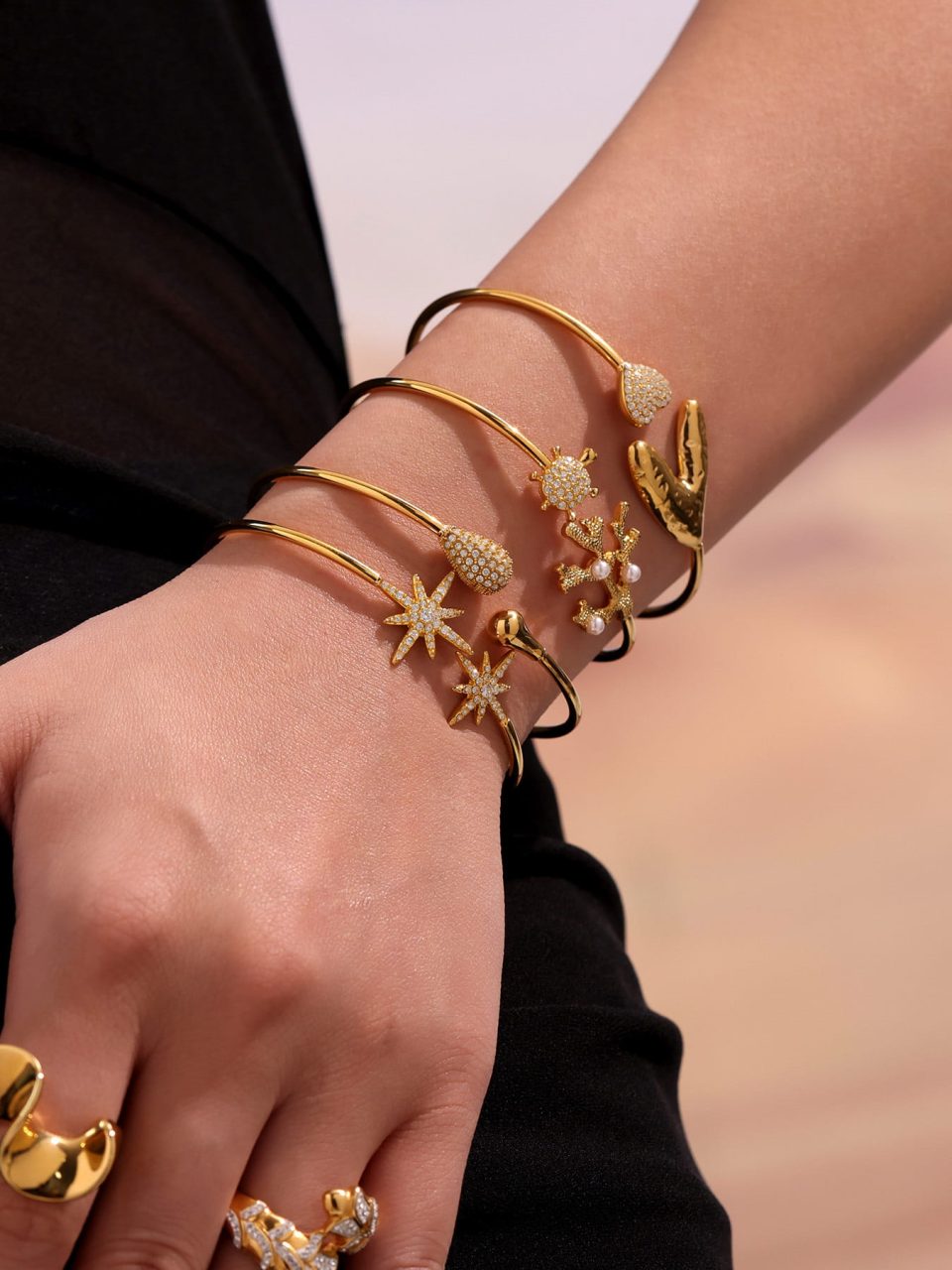 Model wearing a gold zircon bangle Z451-