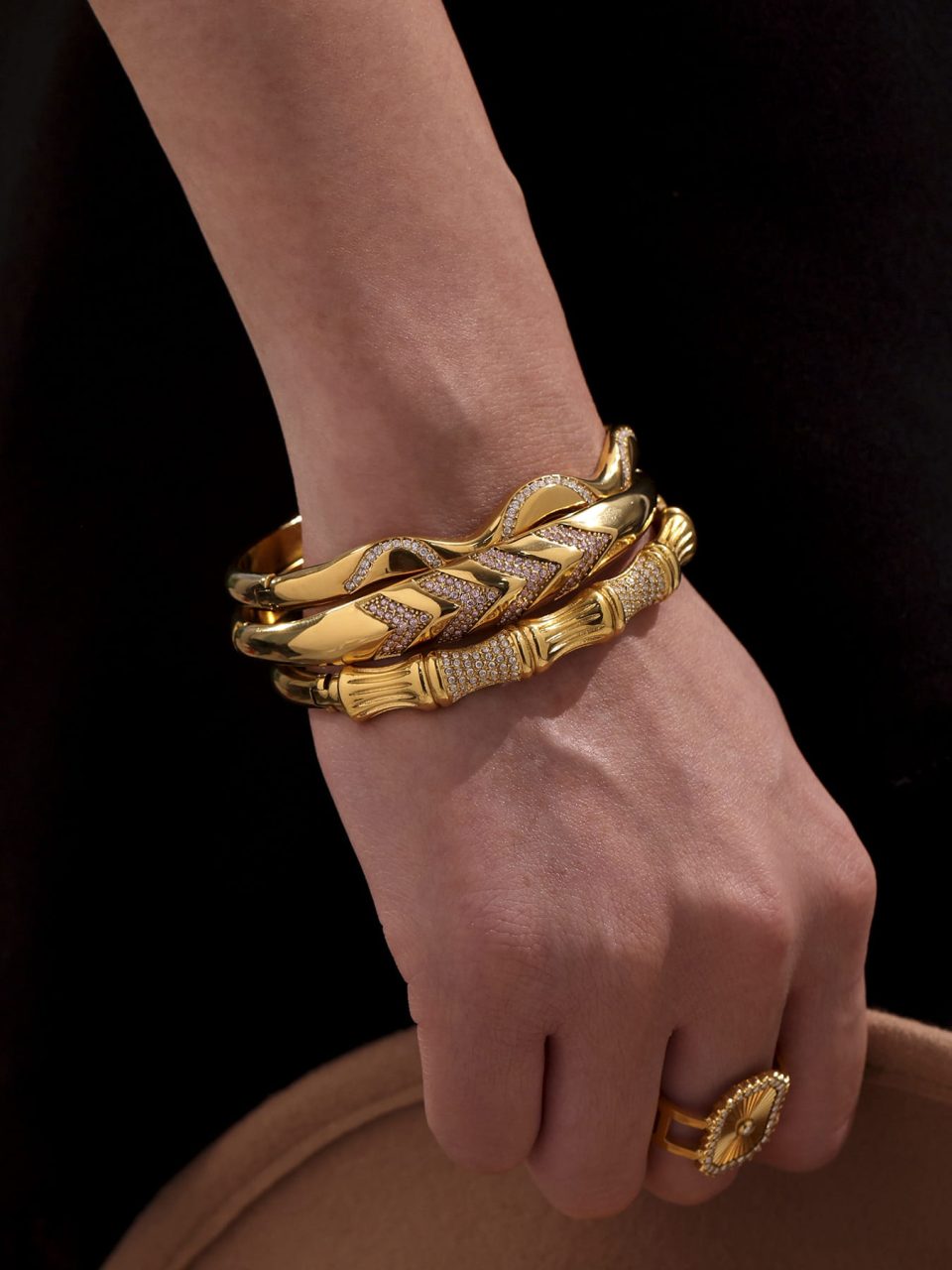 Model showcasing waterproof gold bamboo zircon bangle bracelet