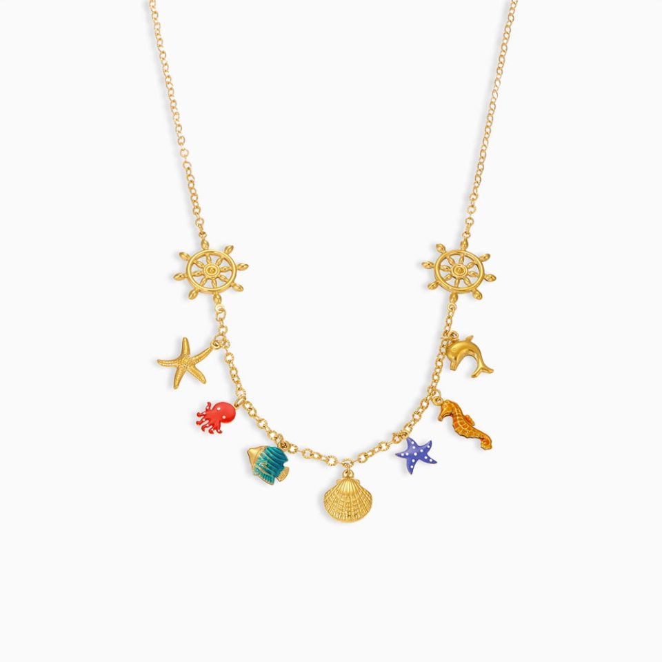 Gold starfish and shell necklace with colorful enamel charms on white background