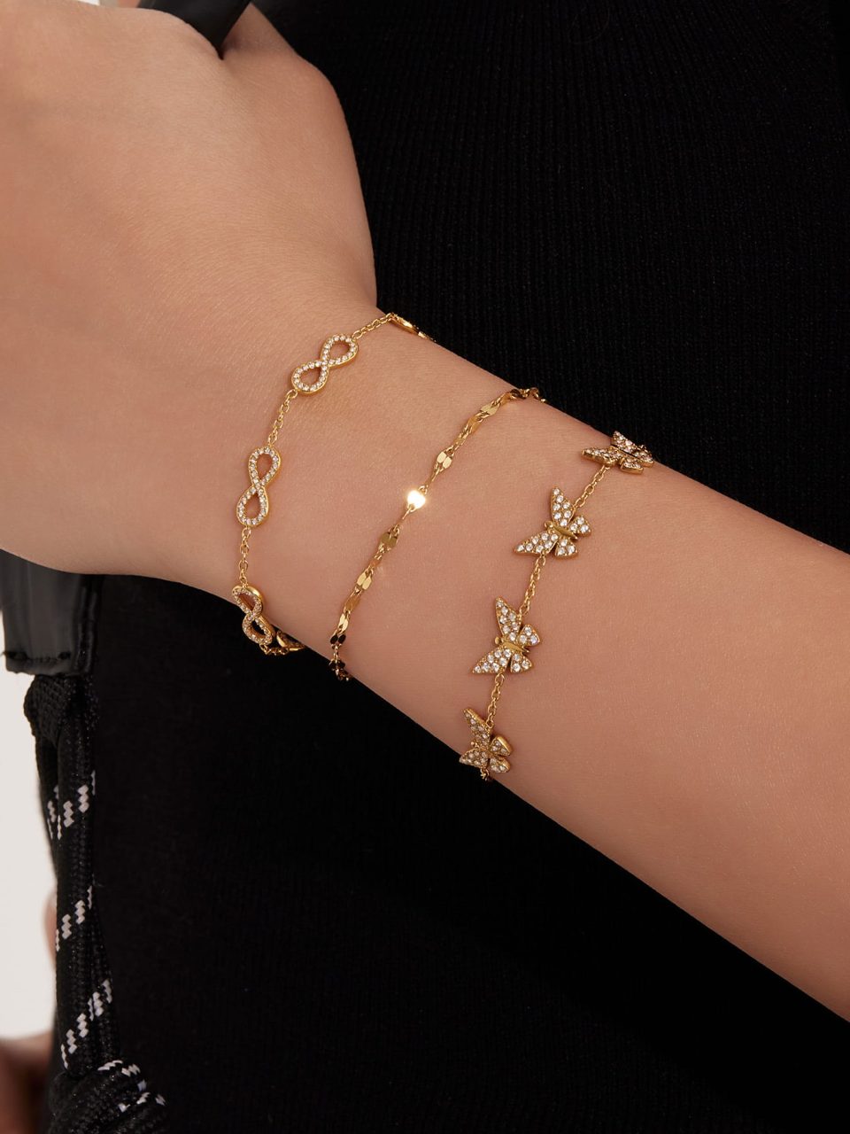 Close-up of Gold Multi-Butterfly Cubic Zirconia Bracelet on Model – Stainless Steel Jewelry
