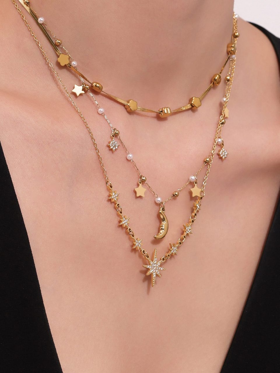 Model wearing a gold eight-pointed star zircon necklace P073--